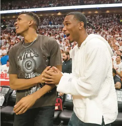  ?? JOHN MCCALL/SOUTH FLORIDA SUN SENTINEL ?? The Heat’s Orlando Robinson, left, and Jamal Cain during Game 6 of the Eastern Conference finals on May 27 at Kaseya Center in Miami.