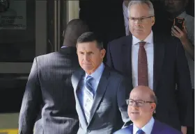  ?? Essdras M. Suarez / Washington Post ?? Michael Flynn leaves the federal courthouse Friday in Washington. President Trump now cites lying to the FBI as a reason for firing his former senior aide.