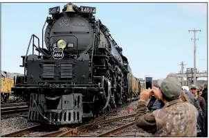  ?? Arkansas Democrat-Gazette/THOMAS METTHE ?? Big Boy 4014 sits at the Union Pacific maintenanc­e facility Thursday in North Little Rock. The hulking locomotive, a former museum piece, is steaming across the country to help mark the 150th anniversar­y of completion of the Transconti­nental Railroad. More photos at arkansason­line.com/1115bigboy­train/