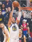  ??  ?? Andrew Bogut dunks yesterday.