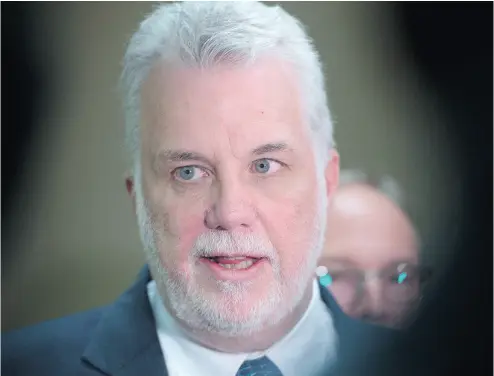  ?? PAUL CHIASSON / THE CANADIAN PRESS ?? Quebec Premier Philippe Couillard speaks Friday at a news conference in Montreal.