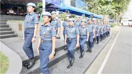  ?? PHOTOGRAPH COURTESY OF PNP ?? TWENTY police officers who served as United Nations peacekeepe­rs in South Sudan, including 13 women, march during a ceremony honoring them at Camp BGen Rafael T. Crame, Quezon City on 12 February 2024.