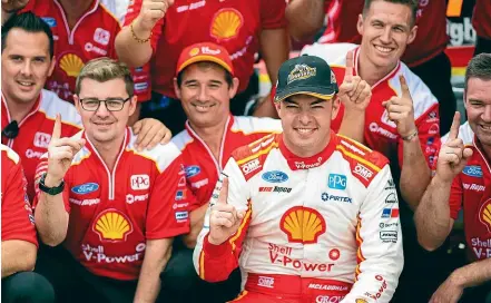  ?? GETTY IMAGES ?? Scott Mclaughlin and his DJR Team Penske team are all smiles after winning both races in the opening Supercars round in Adelaide.