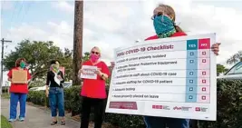  ?? PTI ?? Kimberly Smith, a registered ICU nurse at Corpus Christi Medical Center - Doctor's Regional, protests the lack of personal protective equipment and COVID-19 preparedne­ss at the hospital in Corpus Christi, Texas on Wednesday