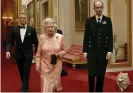  ?? Ceremony. Photograph: LOCOG/AFP/Getty ?? Her Majesty’s secret service … the Queen with James Bond, shortly before she skydived into the 2012 Olympics opening