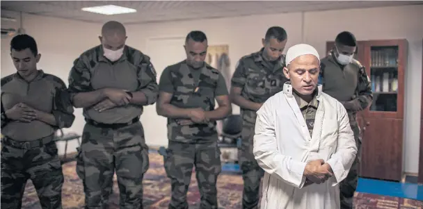  ??  ?? Jean-Jacques, the Muslim chaplain at a mosque on a French army base in southern Lebanon, conducting Friday prayers.