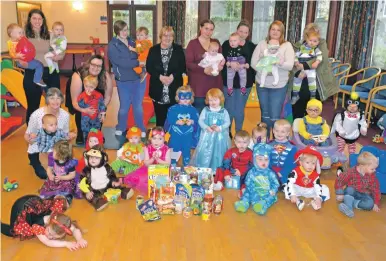  ?? 25_c44tots01 ?? Carers and children at Tiny Tots lined up for the Courier.