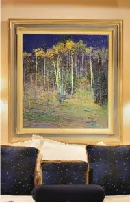  ??  ?? Aspens by Night, by Jerry Jordan, hangs in the bedroom.