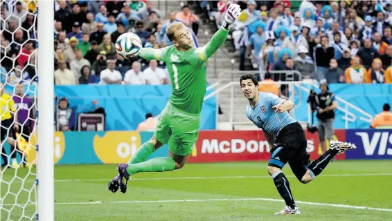  ?? F e l i p e Da na / t h e ass o c i at e d p r e ss ?? England goalkeeper Joe Hart can’t stop Uruguay’s Luis Suarez’s header to open the scoring on Thursday. Uruguay won 2-1.