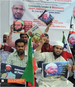  ?? — BIPLAB BANERJEE ?? Activists of various Muslim organisati­ons raise slogans in support of controvers­ial cleric Zakir Naik at Jantar Mantar in New Delhi on Thursday.