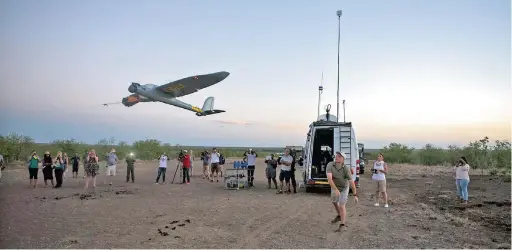  ?? PICTURE: EPA ?? EYE IN THE SKY: Unmanned Aerial Vehicle (UAV) pilot Stephan Denecker launches a UAV with a bungee system on an airstrip at the Kruger National Park. The UAV technology is part of the an anti-poaching iniative to be implemente­d in the Kruger National Park for next year.