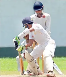  ??  ?? Royal College batsman Pasindu Suriyaband­ara is bowled by Kavindu Ediriweera of Mahinda College.