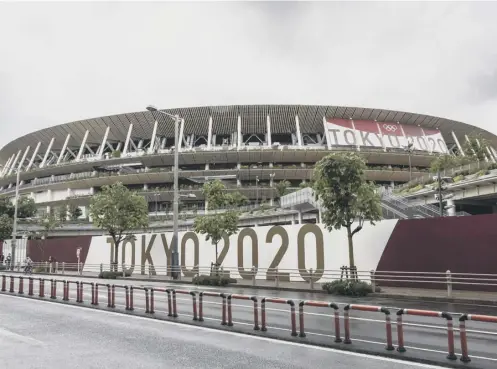  ??  ?? 0 The new National Stadium in Tokyo pictured yesterday as the postponed Olympic Games draws closer