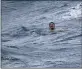  ?? COAST GUARD — FOR THE ASSOCIATED PRESS ?? A man treads water and waits for rescue about 32 miles southeast of Key West, Fla., on Tuesday. The Coast Guard and a good Samaritan rescued 13 people after their boat capsized off of Key West as Tropical Storm Elsa approached.