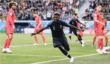  ?? Picture: REUTERS ?? START YOUR ENGINES: France’s Samuel Umtiti celebrates after scoring his goal against Belgium last night.