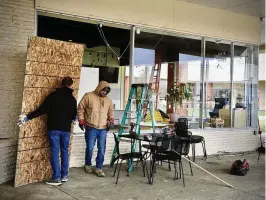  ?? MARSHALL GORBY / STAFF ?? Big Lots and Yumi Boba Tea at the Airway Shopping Center had windows blown out after strong winds came through the area early Wednesday morning.