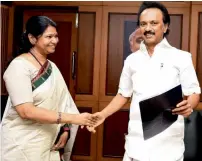  ?? PTI ?? Late DMK chief M Karunnidhi’s daughter Kanimozhi greets her brother DMK working president MK Stalin after being elected as president of the DMK at the party headquarte­rs in Chennai. —