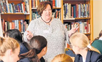  ??  ?? Inspiratio­n Clare Pinchbeck of Hettie’s Tearoom addresses the girls at Kilgraston