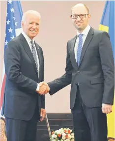  ??  ?? Ukraine’s acting Prime Minister Arseniy Yatsenyuk (right) shakes hands with US Vice President Joe Biden before their meeting in Kiev. — AFP photo