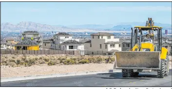  ?? L.E. Baskow Las Vegas Review-journal ?? Constructi­on continues on a Las Vegas housing developmen­t in March. A new report shows that although new homebuying has slowed, Southern Nevada homebuilde­rs recorded their second-highest April for new-home sales over the last five years.