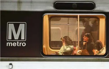  ??  ?? Travel hassle: Commuters in Washington DC are facing long walks home on the weekend as repair work is carried out on the metro system. — AFP