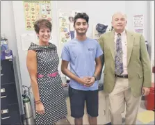  ?? Photos by Lori Van Buren / Times Union ?? From left, Lori Caplan, Watervliet school superinten­dent; senior student Zagham Shah; and David Shippee, president and CEO of Whitney M. Young, Jr. Health Center, stand in the health center on Friday. The center is located in the nurses’ office of the school.