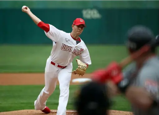  ?? Chung Sung-Jun/Getty Images ?? Nick Kingham started the season opener for the SK Wyverns of the Korean Baseball Organizati­on Tuesday against the Hanwha Eagles. “Pitching on opening day is a huge honor,” Kingham said.