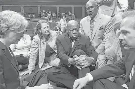  ?? AFP file photo / U.S. Rep. Elizabeth Esty ?? Rep. Elizabeth Esty, second from left, Rep. John Lewis, center, and other members of Congress stage a sit-in on the floor of the U.S. House of Representa­tives on June 22, demanding a vote on gun control.