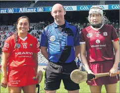  ?? (Pic: INPHO/Ryan Byrne) ?? Cork’s Amy O’Connor and Galway’s Shauna Healy with referee Justin Heffernan at the coin toss prior to the Very Camogie League Division 1A final in Croke Park.