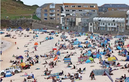  ?? ?? 6Porthmeor beach in St Ives is one of the many popular visitor destinatio­ns. Below, Malcolm Bell
Greg Martin