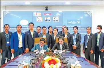  ?? SUPPLIED ?? Securities and Exchange Regulator of Cambodia (SERC) and ACLEDA Bank sign MoU on usage of electronic payment services on December 7.