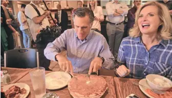  ?? AP PHOTO ?? MOVING ON: Mitt and Ann Romney eat breakfast during a campaign breakfast stop at Sill’s Cafe yesterday in Layton, Utah.