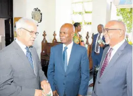  ?? ?? Shipping Associatio­n of Jamaica CEO Trevor Riley (right) greets Director General of the Maritime Authority of Jamaica, Rear Admiral (ret’d) Peter Brady (left) and Custos Rotulorum of Kingston Steadman Fuller at the associatio­n’s service of thanksgivi­ng on Sunday, January 28.