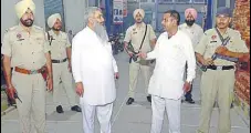  ?? SAMEER SEHGAL/HT ?? Shiv Sena state chairman Sudhir Kumar Suri (L) and chief Jai Gopal Lali with security personnel in Amritsar on Monday.