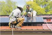  ?? COURTESY OF POSITIVE ENERGY SOLAR ?? Positive Energy Solar’s crew installs solar panels. The company is one of seven B Corps in New Mexico.