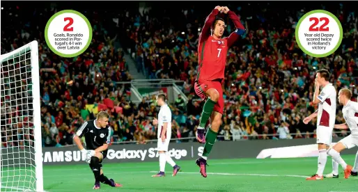  ?? AFP ?? Goals, Ronaldo scored in Portugal’s 4-1 win over Latvia Year old Depay scored twice in Holland’s victory Portugal’s Cristiano Ronaldo (centre) celebrates after scoring the opening goal against Latvia during the World Cup 2018 qualifying football match....