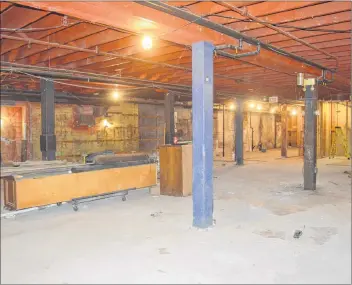  ?? CHRIS SHANNON/CAPE BRETON POST ?? The upper level of the former Smooth Herman’s cabaret nightclub was nearly stripped to the floor boards and beams. Some of the wood lining the walls will be reused in the new Cape Breton Farmers’ Market, and there is also a plan to shine light in from previously covered-over windows. Once complete, the walls will also feature a much lighter colour scheme.