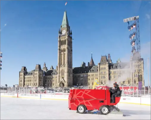  ?? CP PHOTO ?? A Zamboni attempts to groom the ice surface on the Canada 150 ice rink on Parliament Hill in Ottawa on Wednesday. Mother Nature drowned out Canada Day on Parliament Hill and now she’s doing her best to freeze out New Year’s Eve.
