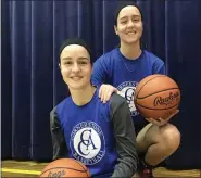  ?? JOHN KAMPF — THE NEWS-HERALD ?? Madison and Michaela Cloonan are sharing a memorable ride as four-year starters for Cornerston­e Christian.