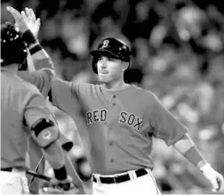  ?? BARRY CHIN/GLOBE STAFF ?? Stephen Drew, playing against his former team, is congratula­ted in the sixth inning after briefly tying the game at 6 with a two-run home run.