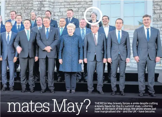  ??  ?? THERESA May bravely forces a smile despite cutting a lonely figure for the EU summit snap. Loitering sadly at the back of the group, the photo shows just how marginalis­ed she – and the UK – have become.