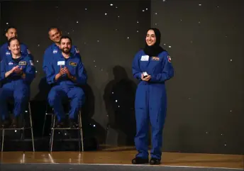  ?? — AFP photos by Mark Felix ?? AlMatroosh­i, a NASA Artemis astronaut candidate graduate, smiles during a ceremony at Johnson Space Center in Houston, Texas.