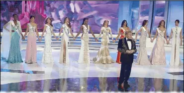  ?? AP ?? Miss Venezuela President Osmel Sousa poses with the beauty pageant’s 10 semifinali­sts in Caracas, Venezuela in 2014.