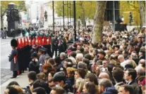  ?? TOBY MELVILLE/POOL VIA AP ?? Crowds gather ahead of the Remembranc­e Sunday service at the Cenotaph, in Whitehall, London, on Sunday.