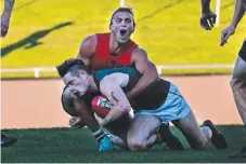  ?? Picture: PATRICK GEE ?? NEAFL’s Jordan Keras wraps up Tasmania’s Taylor Whitford in the representa­tive clash in Hobart.