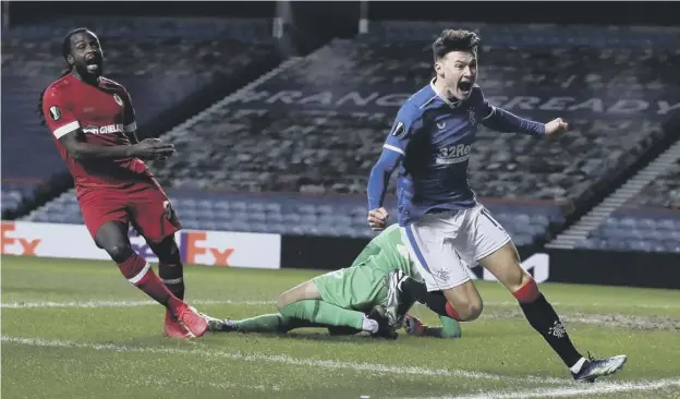  ??  ?? 0 Teenage full-back Nathan Patterson wheels away in delight after scoring in Rangers’ 5-2 second-leg win over Europa League opponents Antwerp