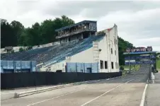  ?? THE ASSOCIATED PRESS ?? The abandoned Akron Rubber Bowl stadium is seen Wednesday with the adjacent Derby Downs soap box derby track in Akron, Ohio. Part of the historic stadium is being torn down this week because it’s a public health hazard.