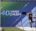 ?? MICHAEL CONROY — THE ASSOCIATED PRESS ?? North Carolina quarterbac­k Mitchell Trubisky runs the 40-yard dash at the NFL Scouting Combine on March 4 in Indianapol­is.
