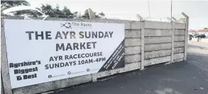  ??  ?? Opening hours A banner promotes the times of the Sunday market at Ayr Racecourse