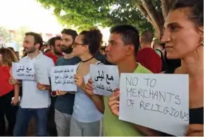  ??  ?? Demonstrat­ors gather in support of Lebanese indie band Mashrou’ Leila at Samir Kassir Square in downtown Beirut.